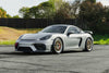 PORSCHE 718 ケイマン GT4 に APEX ML-7RT 19x9J ET50 / 19x10.5J ET44 マシンドリップ モータースポーツゴールドを装着