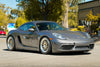 APEX ML-10RT 18x9J / 18x10J 装着の PORSCHE 718 ケイマン S 走行イメージ